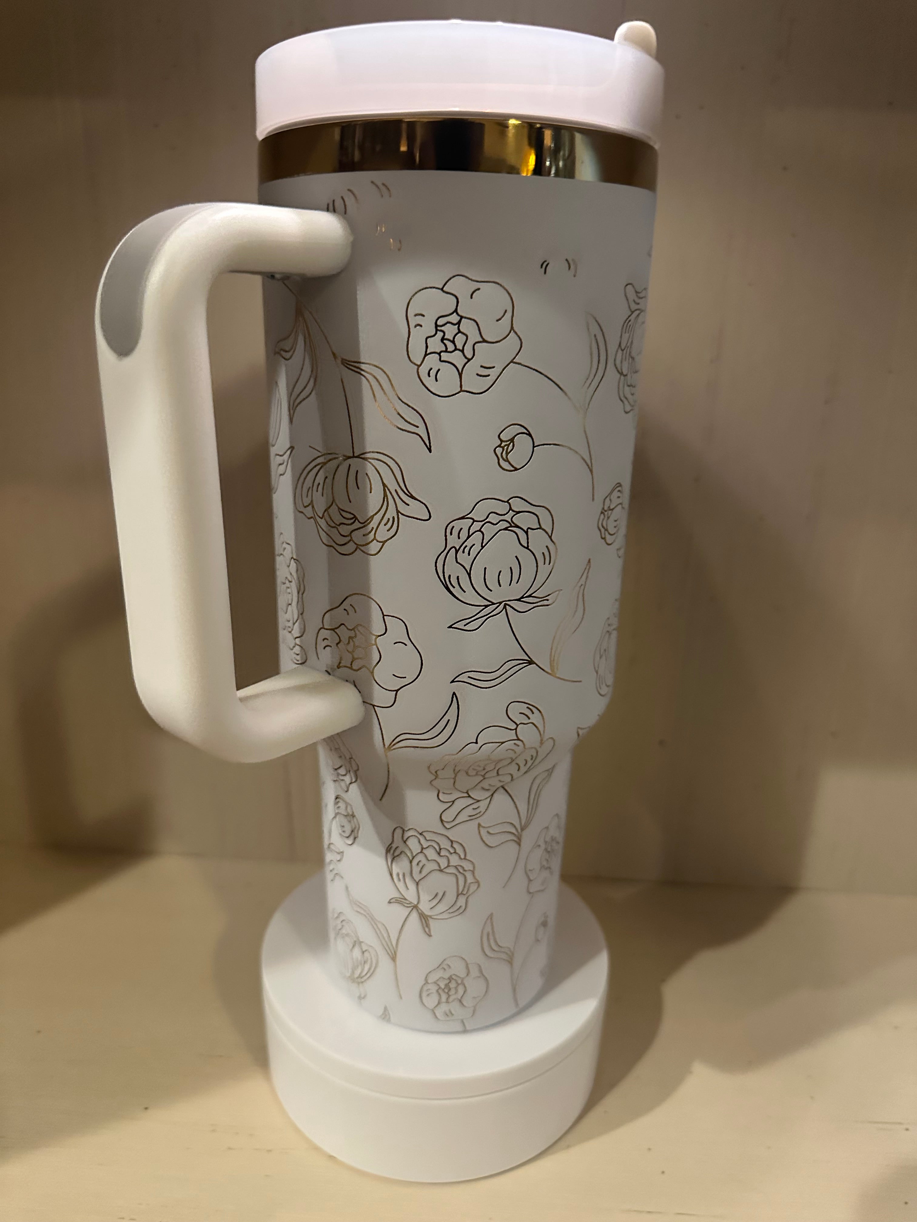 White and gold 40oz laser engraved tumbler Flowers